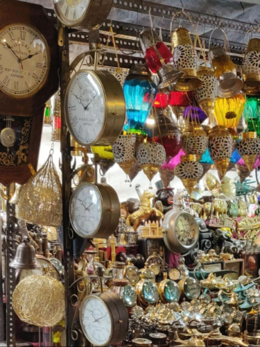 View of a shop with trinkets, home decor, and vintage clocks in Colaba Causeway