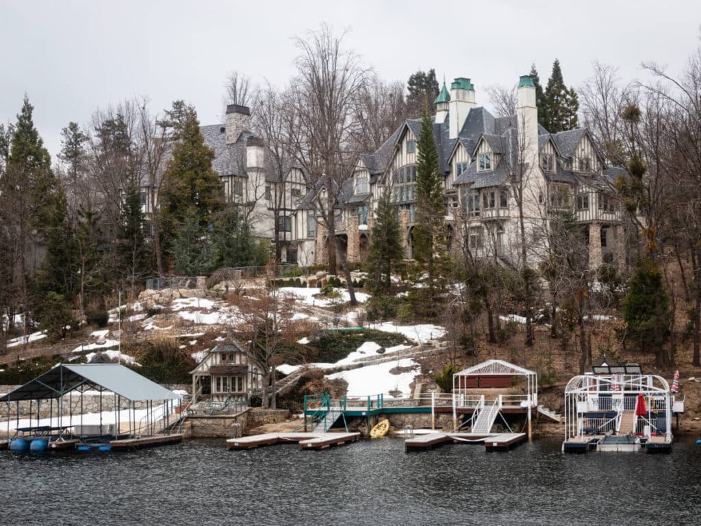 View of a Tudor House with boats on the dock