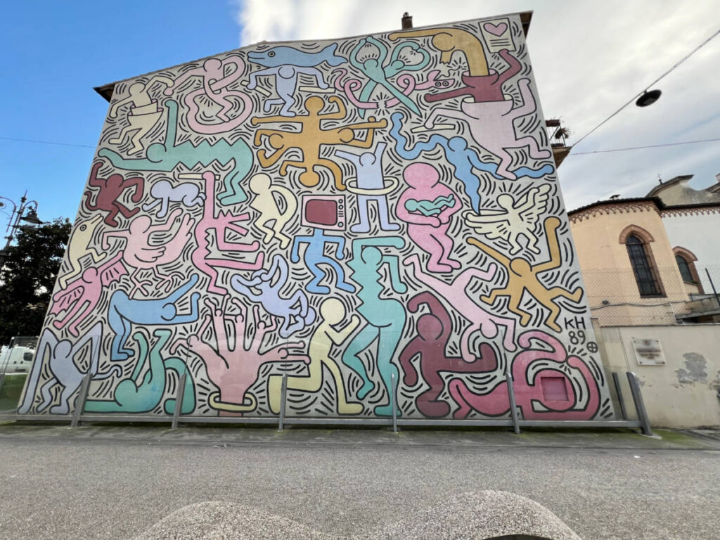 The colorful Tuttomondo street art work by Keith Haring