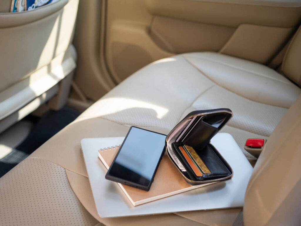 View of valuables in the backseat of the car