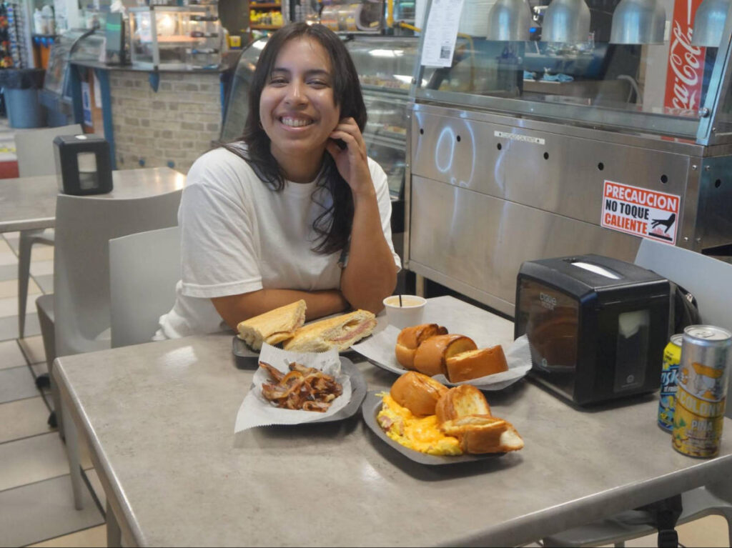 The author Vanessa Ramos, eating breakfast at a local panaderia