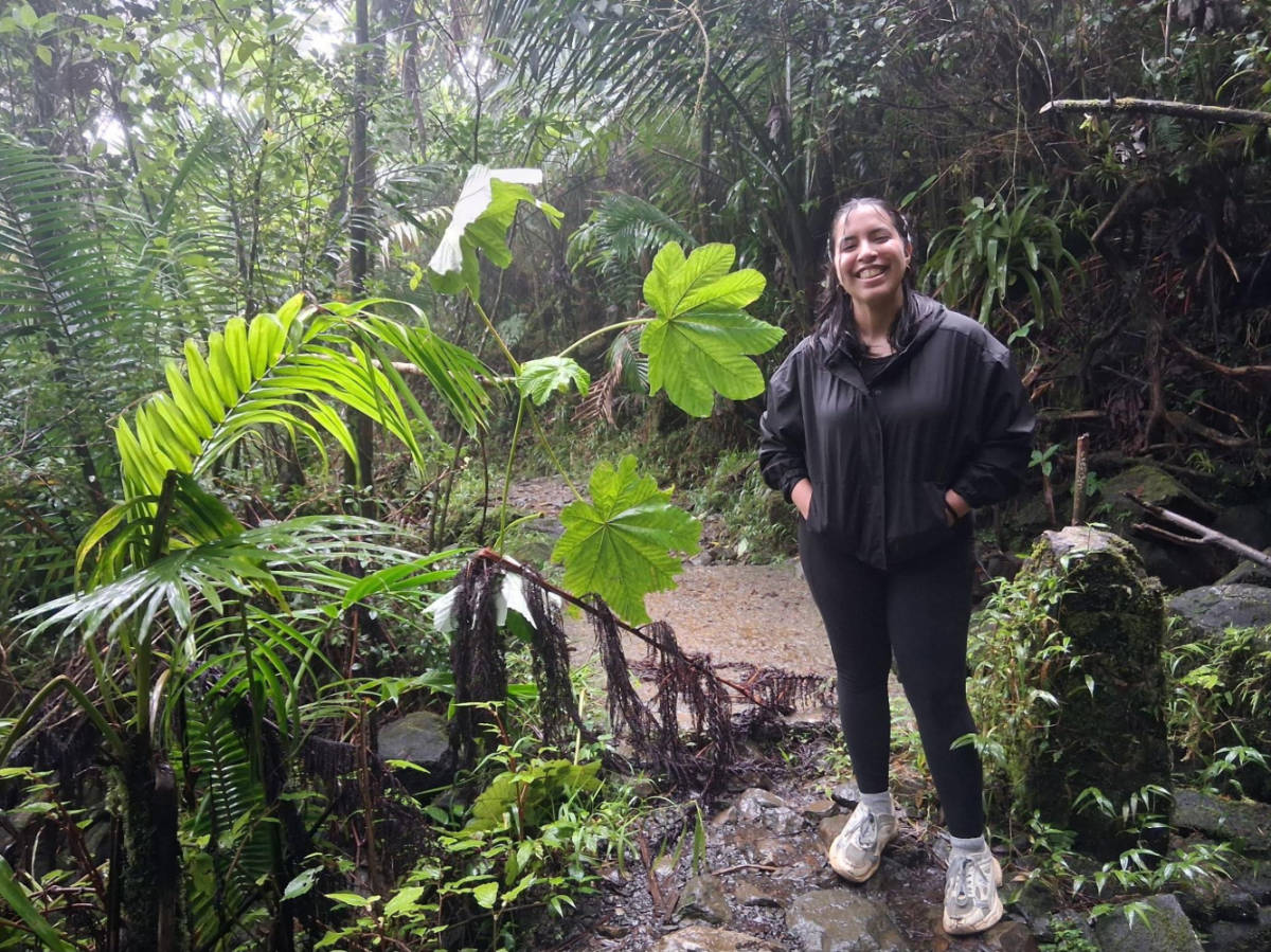 The author Vanessa Ramos, hiking in El Yunque on a rainy day