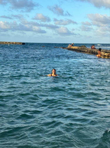 The author Vanessa Ramos, swimming at Escambrón Beach