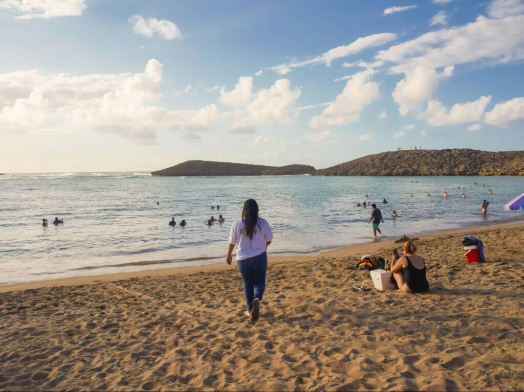 The author Vanessa Ramos, walking along the Playa Puerto Nuevo