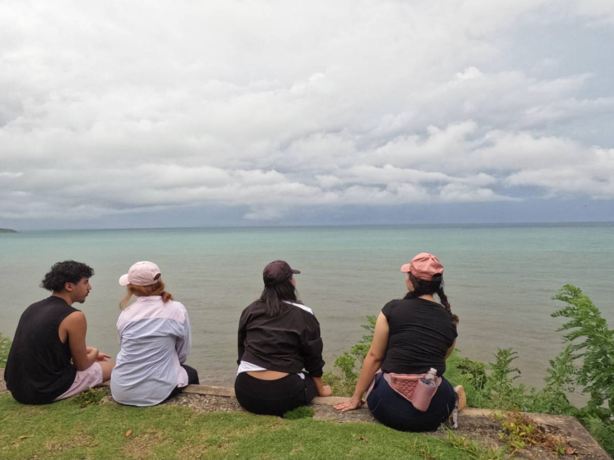 The author Vanessa Ramos and her friends sitting over the bunkers at El Morrillo