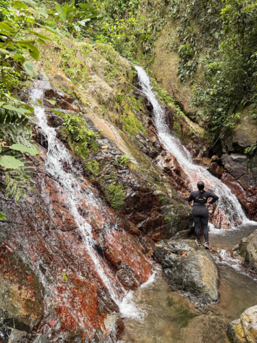 The author Vanessa Ramos, admiring the smaller waterfall at Salto San Salvador