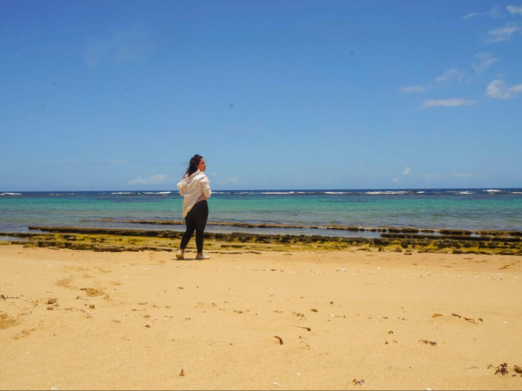 The author Vanessa Ramos enjoying the sun at the beach of Isabela