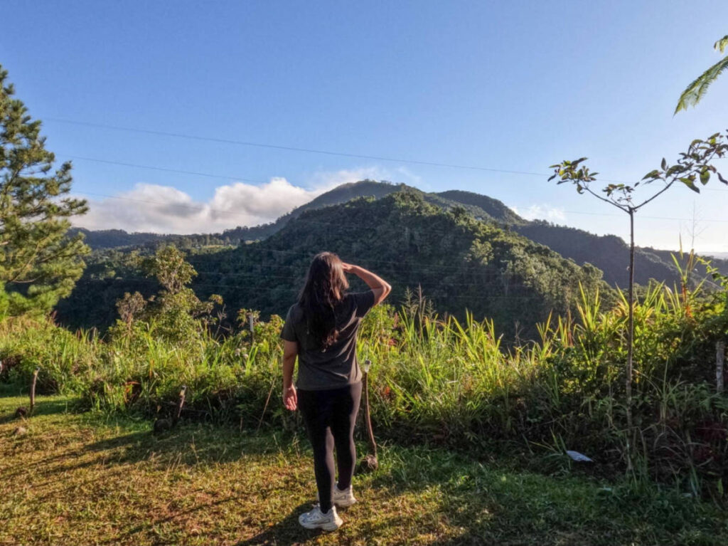 The author Vanessa Ramos, enjoying the overlooking view of the lush greenery in Llanura de los Vientos