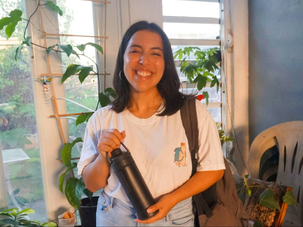 The author Vanessa Ramos, holding the GRAYL GeoPress water bottle
