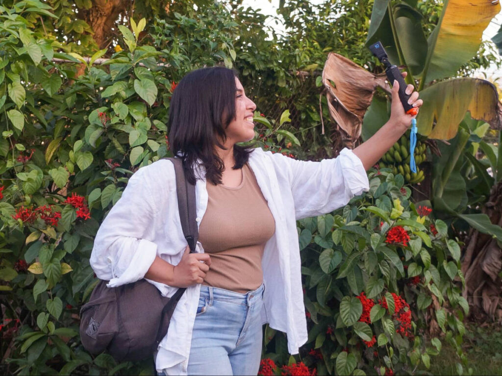 The author Vanessa Ramos, holding a GoPro Hero10