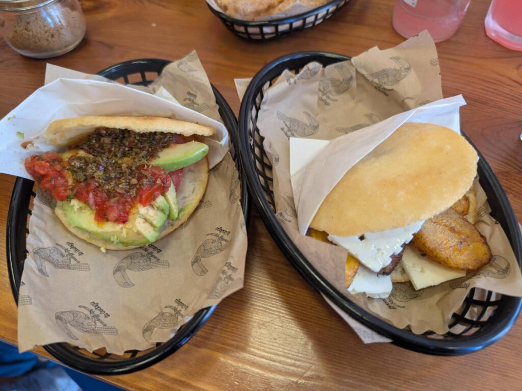 Closeup look of the  vegana arepa and an arepa with plantain and Venezuelan cheese from La Bodega