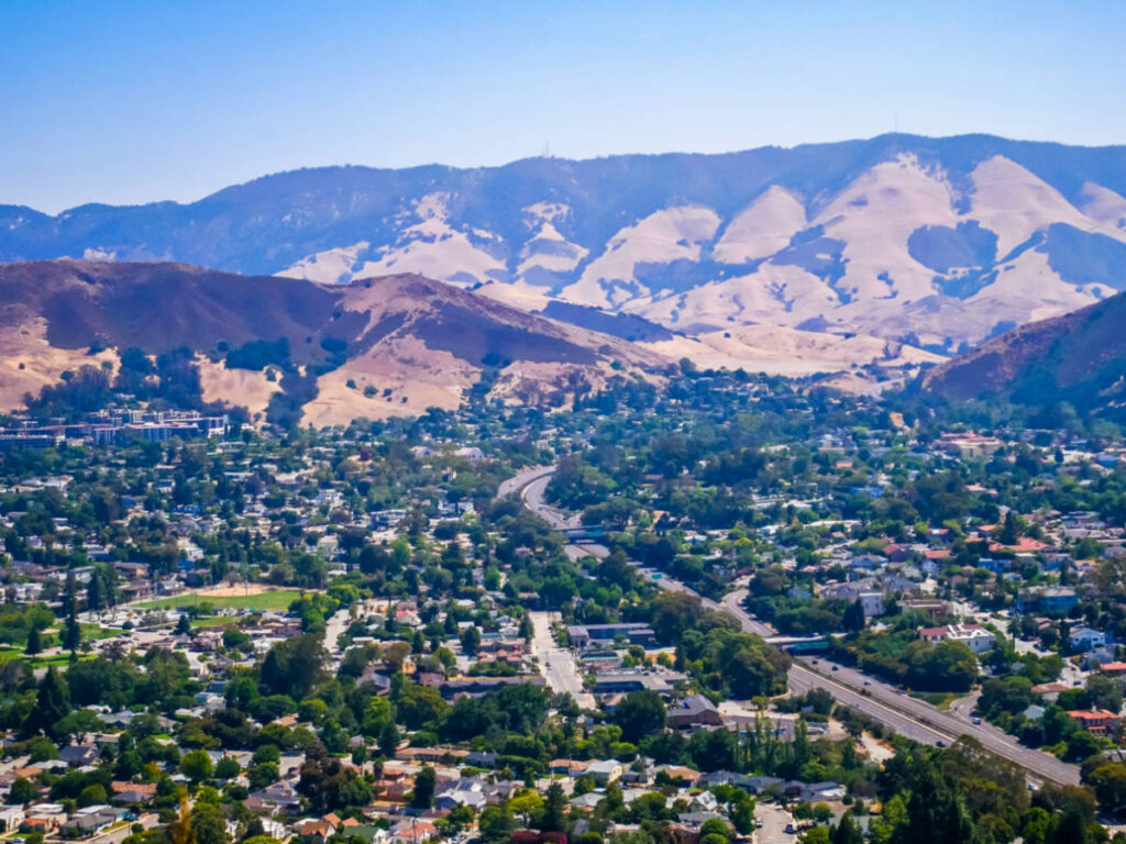 Overlooking view of the mountain ranges and the cityscape from Cerro San Luis Peak