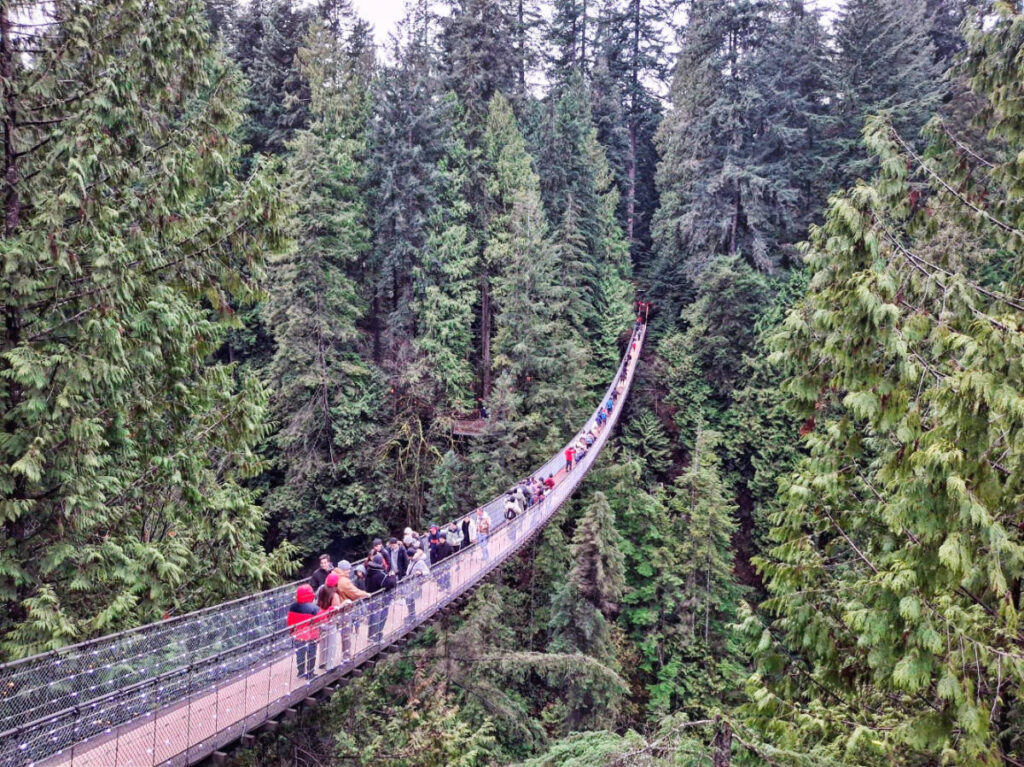 View of people crossing the Capilano Suspension Bridge Park