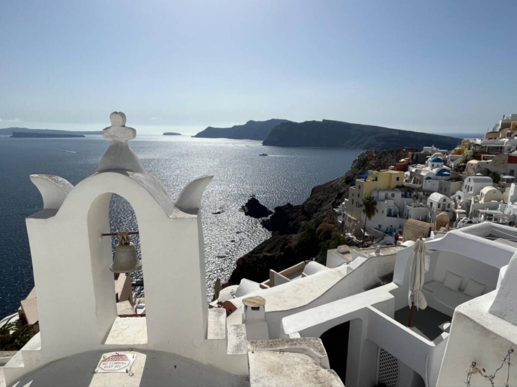 Scenic view of the coastal and whitewashed buildings from Oia