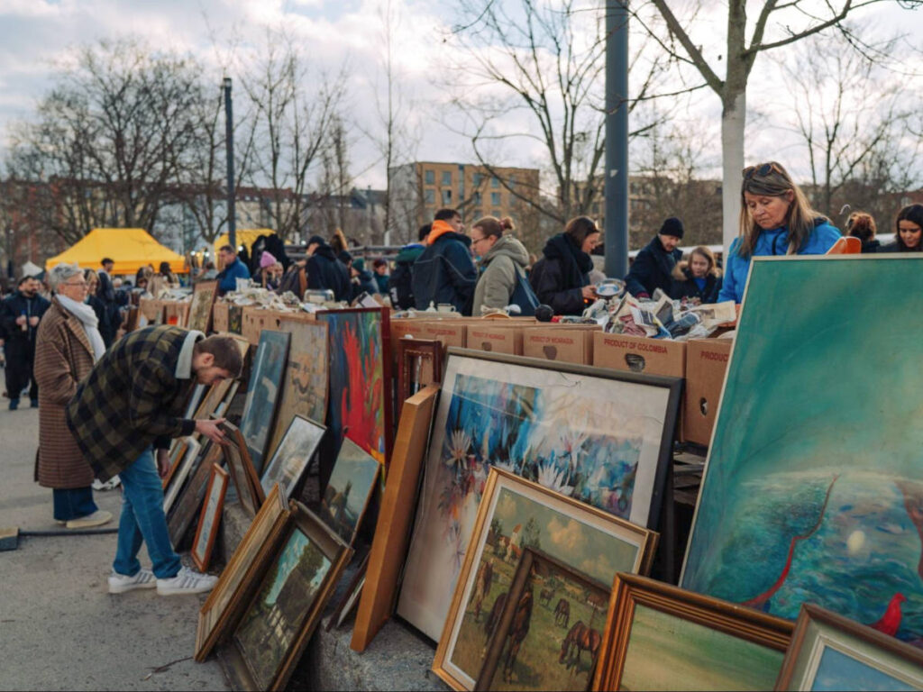 View of the crowd looking at the vintage arts on Mauerpark’s weekly flea market