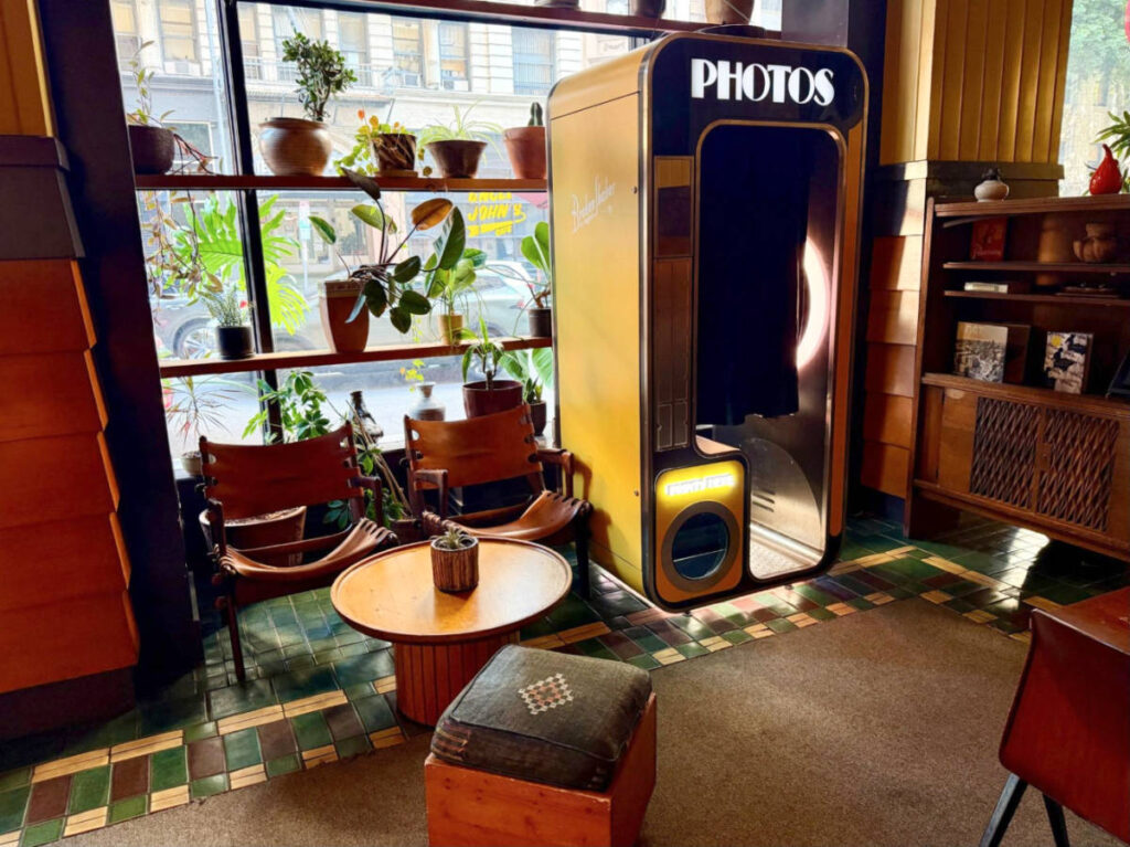 A vintage photo booth in the lobby of Freehand