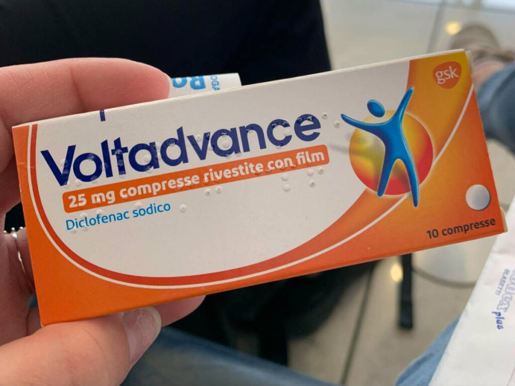 Holding a box of Voltadvance painkillers