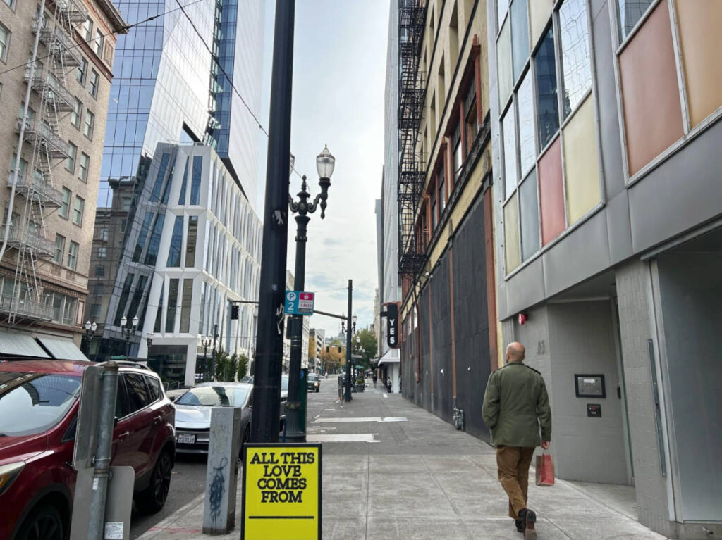 The author's husband walking down the street in Downtown Portland