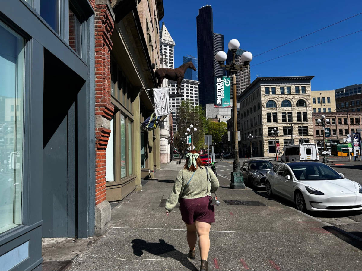 The author's friend walking at the Pioneer Square