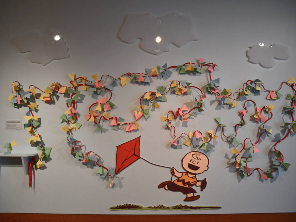 A wall art of a boy flying a kite