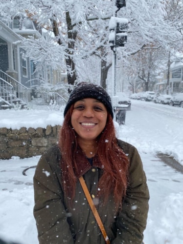The author, Alexandria Taylor smiling for a photo during winter season in Washington DC