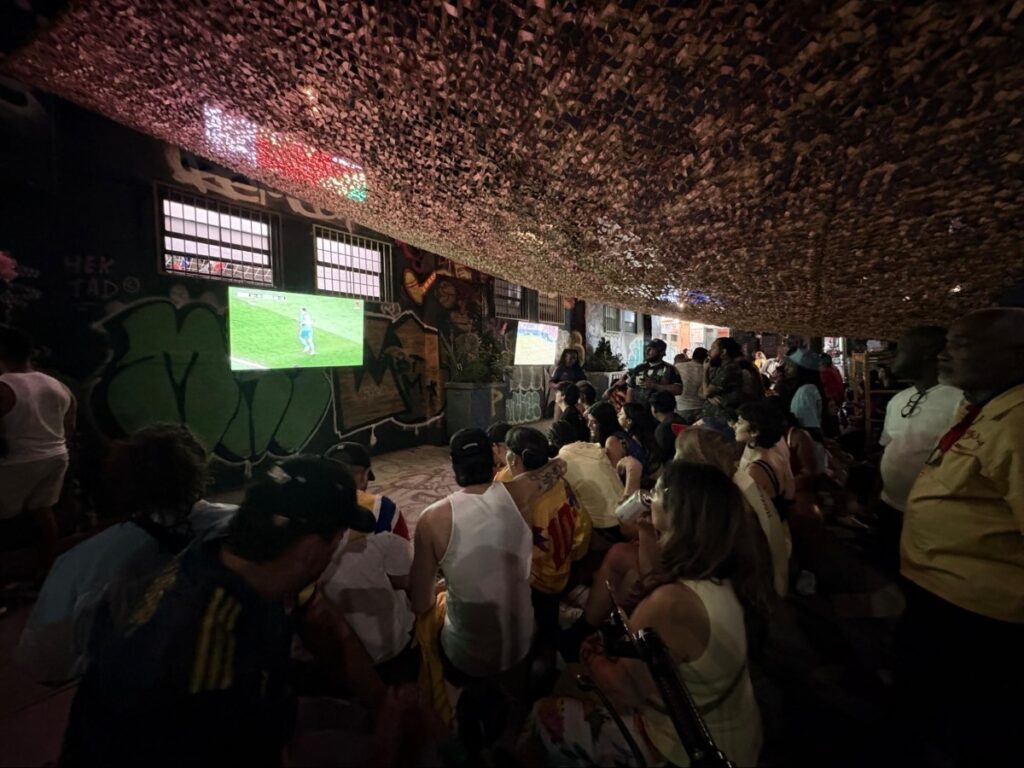 Crowd of people watching the World Cup match where Argentina wins