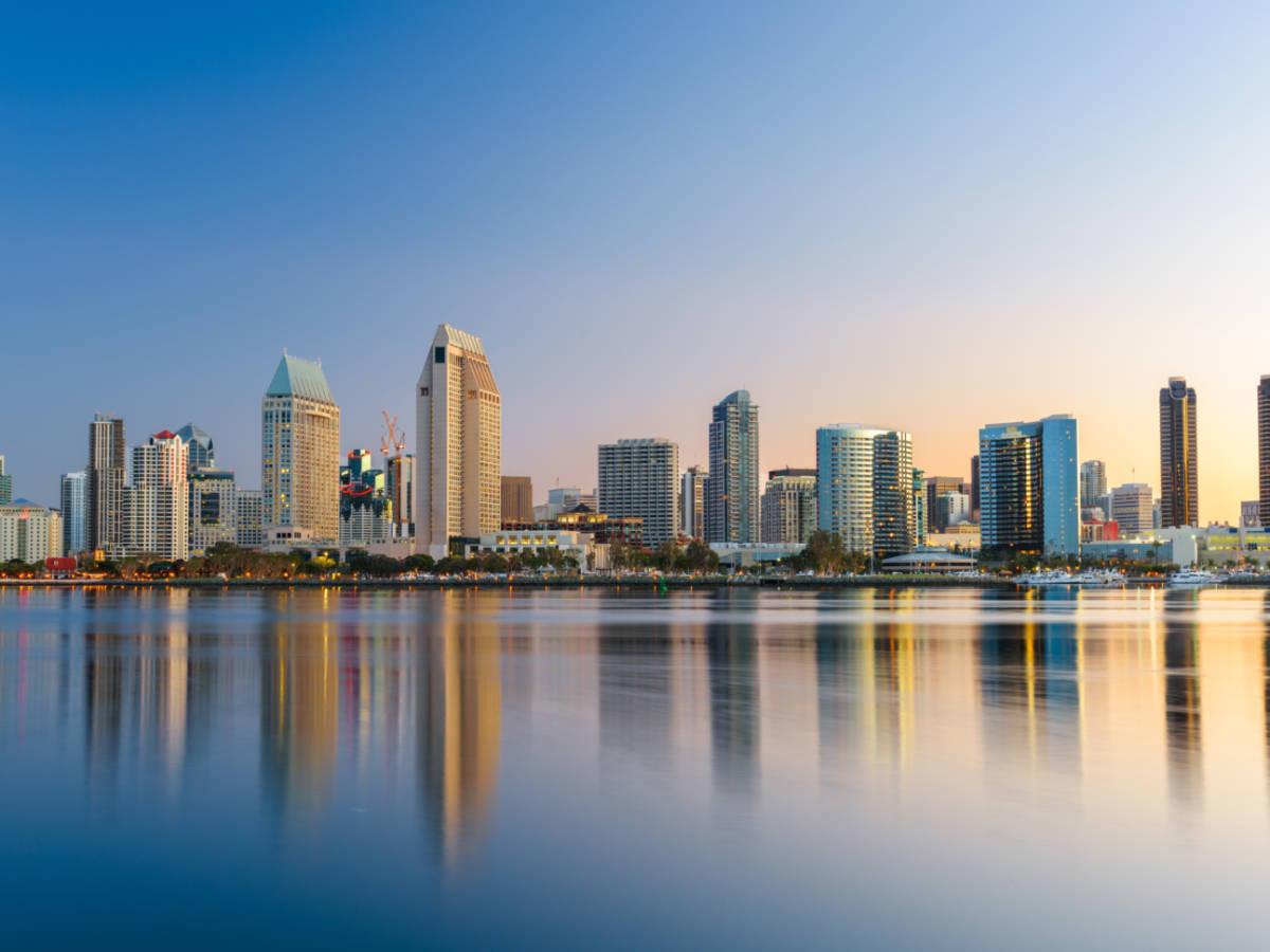 Scenic view of the waterfront Downtown San Diego skyline reflecting on the water at sunset