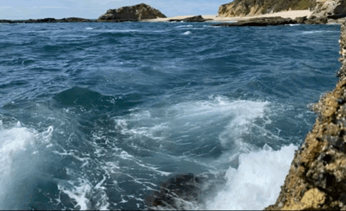 View of the waves crashing on the rock