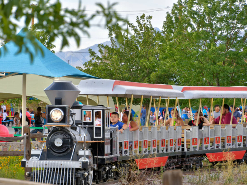 Visitors enjoying a ride on the miniature train at Western Playland Amusement Park