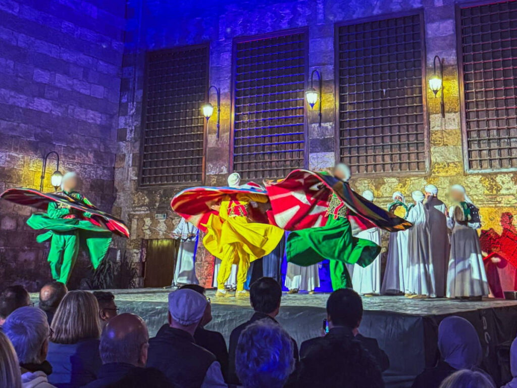 Whirling Dervishes with their colorful costume performing at Wekalet El-Ghouri Arts Center
