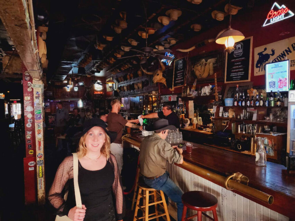 The author Sarah Heath and other people inside the White Elephant Saloon