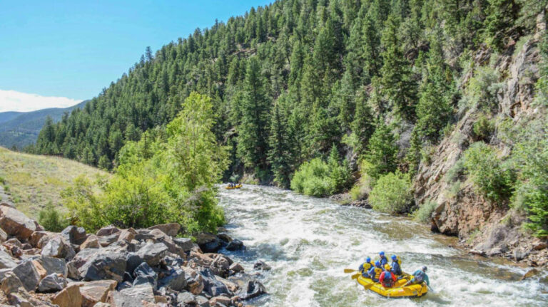 The author Abigail Bliss with her friends during a whitewater rafting tour at summer season