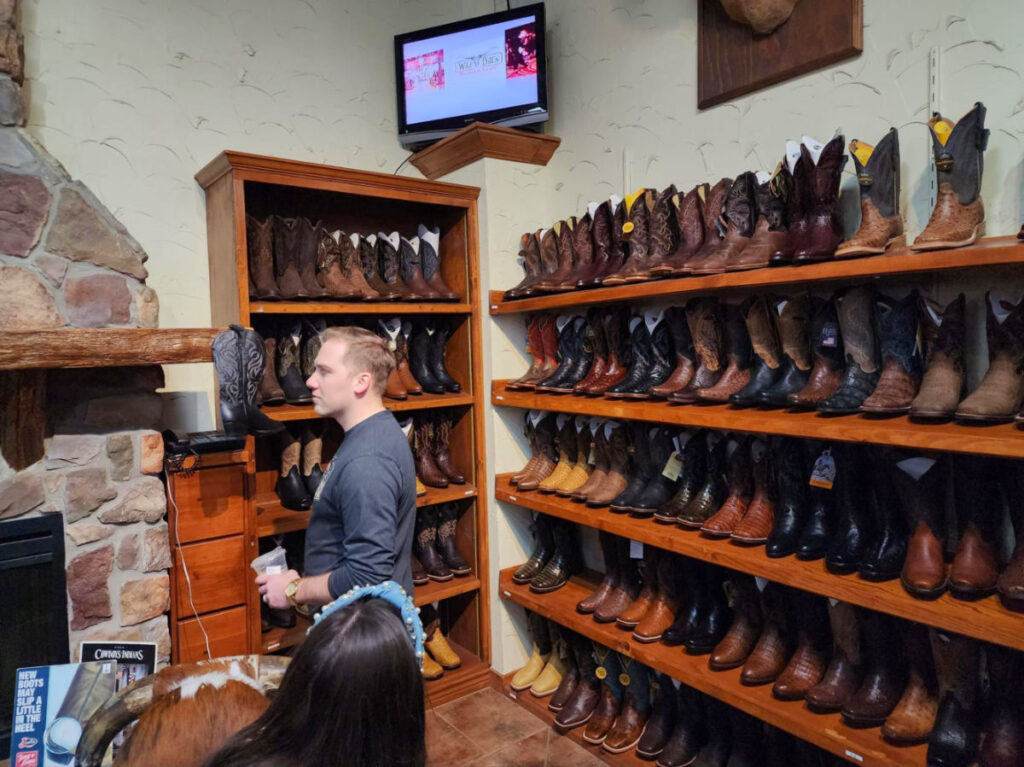 Author Sarah Heath's family browsing for boots at Wild Bills Western Store