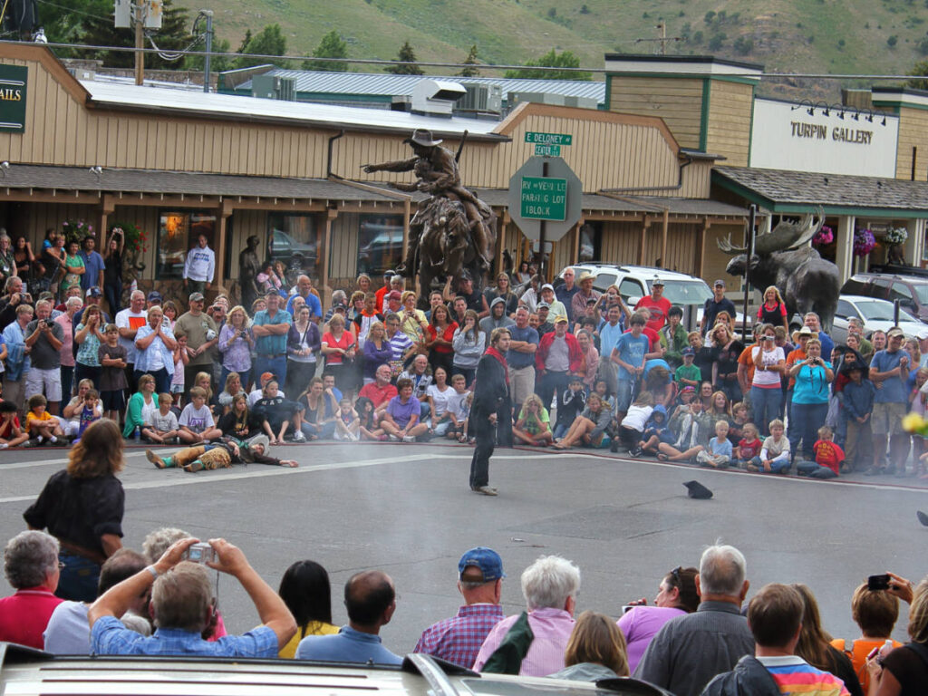 The crowd watching around the Wild West shootout show at the town square