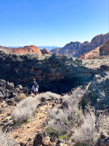 A woman exploring the lava tubes at Snow Canyon State Park