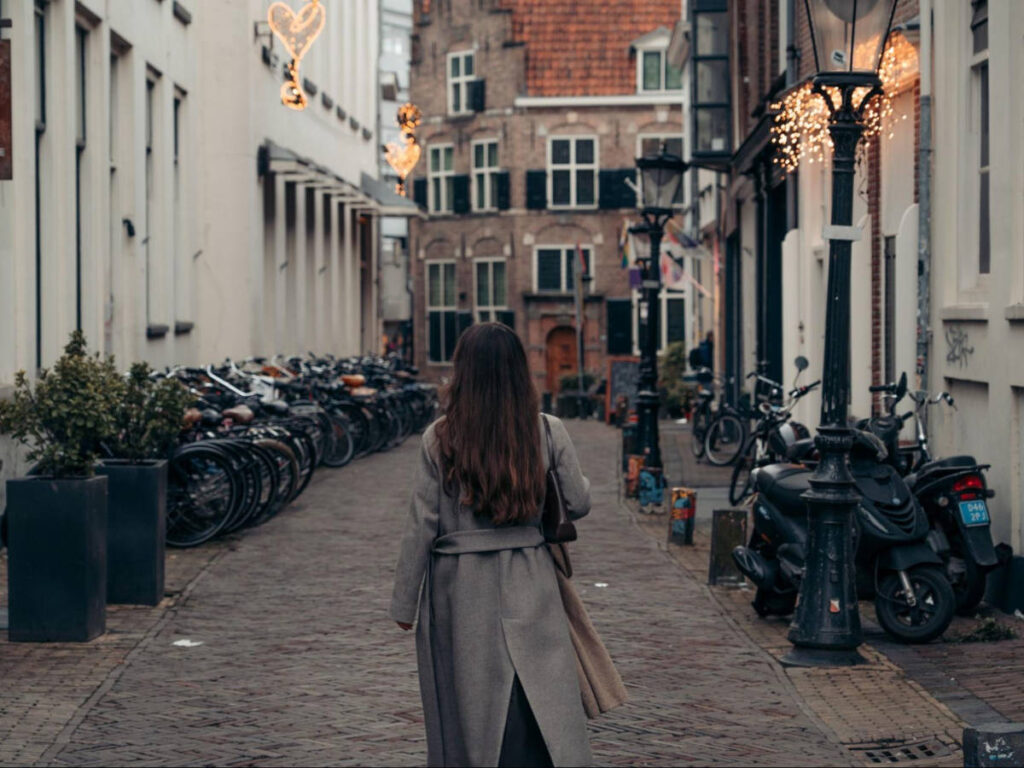 A woman wandering along the streets of Utrecht’s center