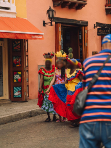 A group of women wearing traditional dresses in Colombia