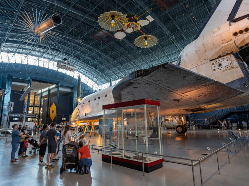 People looking at the displays inside the Wonders of Space
