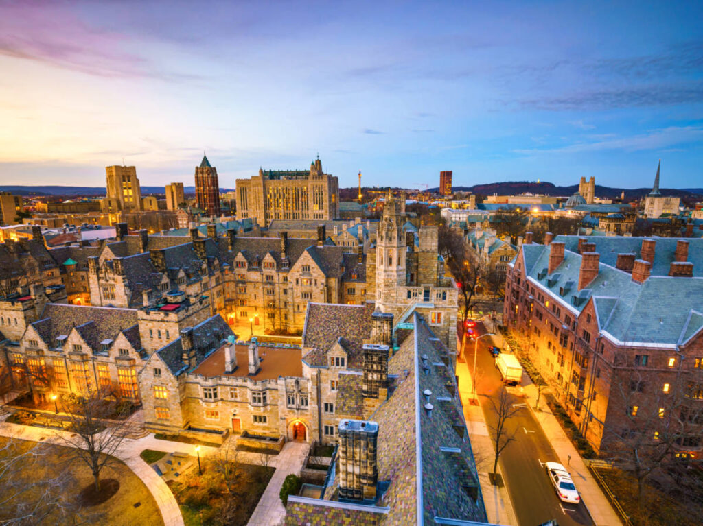 Aerial view of the illuminated historical area of Yale University at dusk
