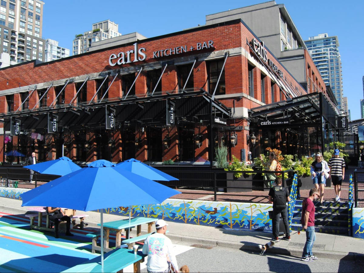 The crowd wandering around the plaza and patios in Yaletown