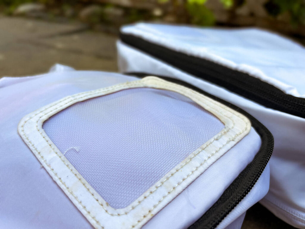 Closeup look of the yellowing tag of the compressed packing cube