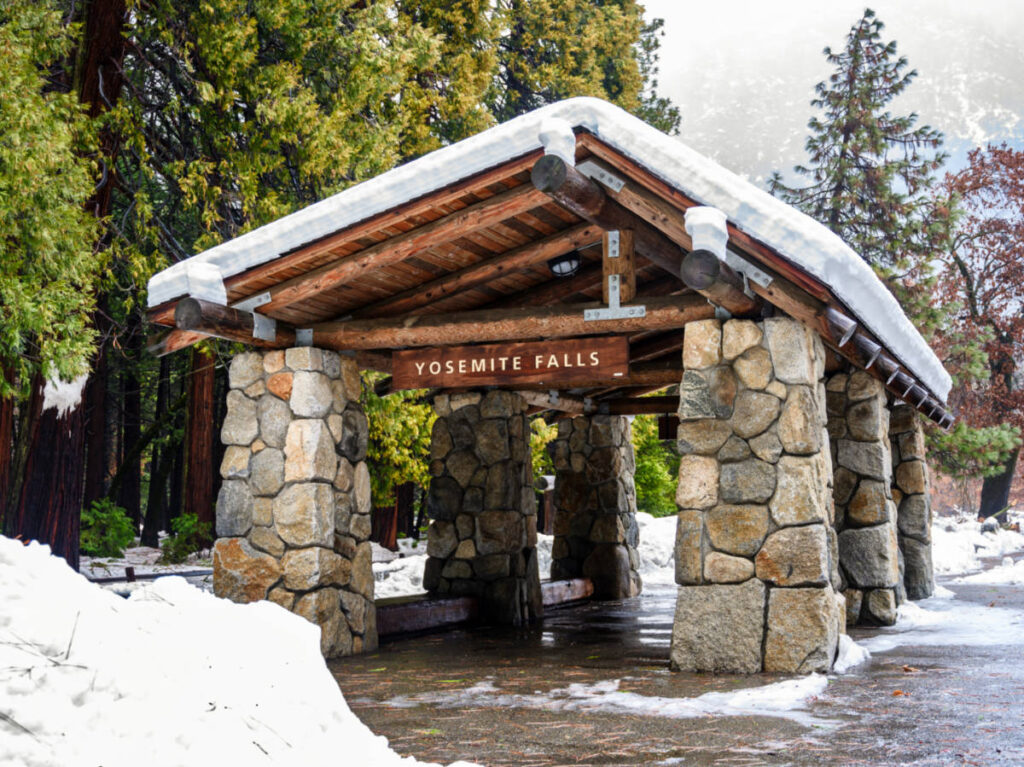 View of the snow over the bus stop at Yosemite Falls