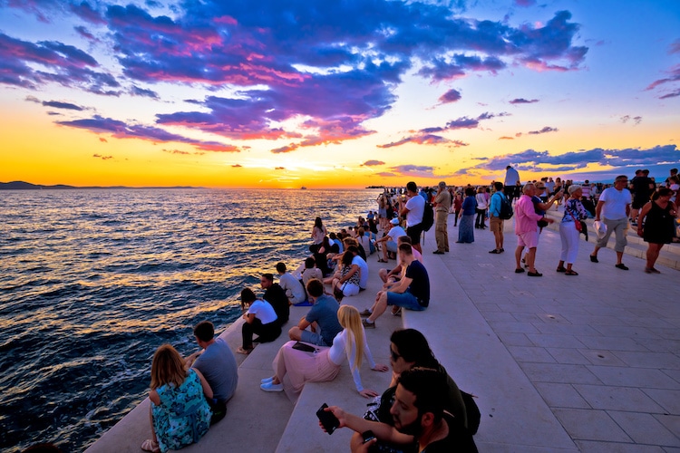 People watching the scenic sunset views at Zadar waterfront
