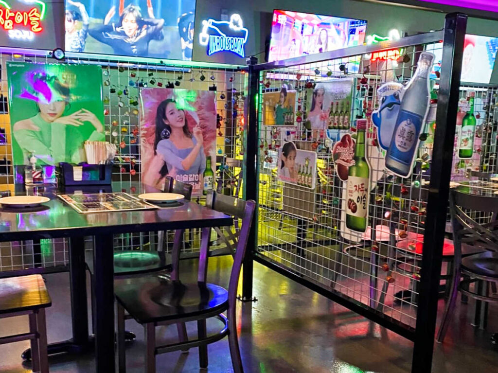 View of the posters and LED signages around the dining area at One Shot Pocha